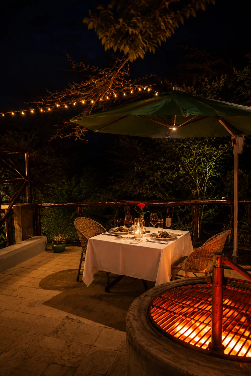 Lanterns, firelight, and a private deck set for two.